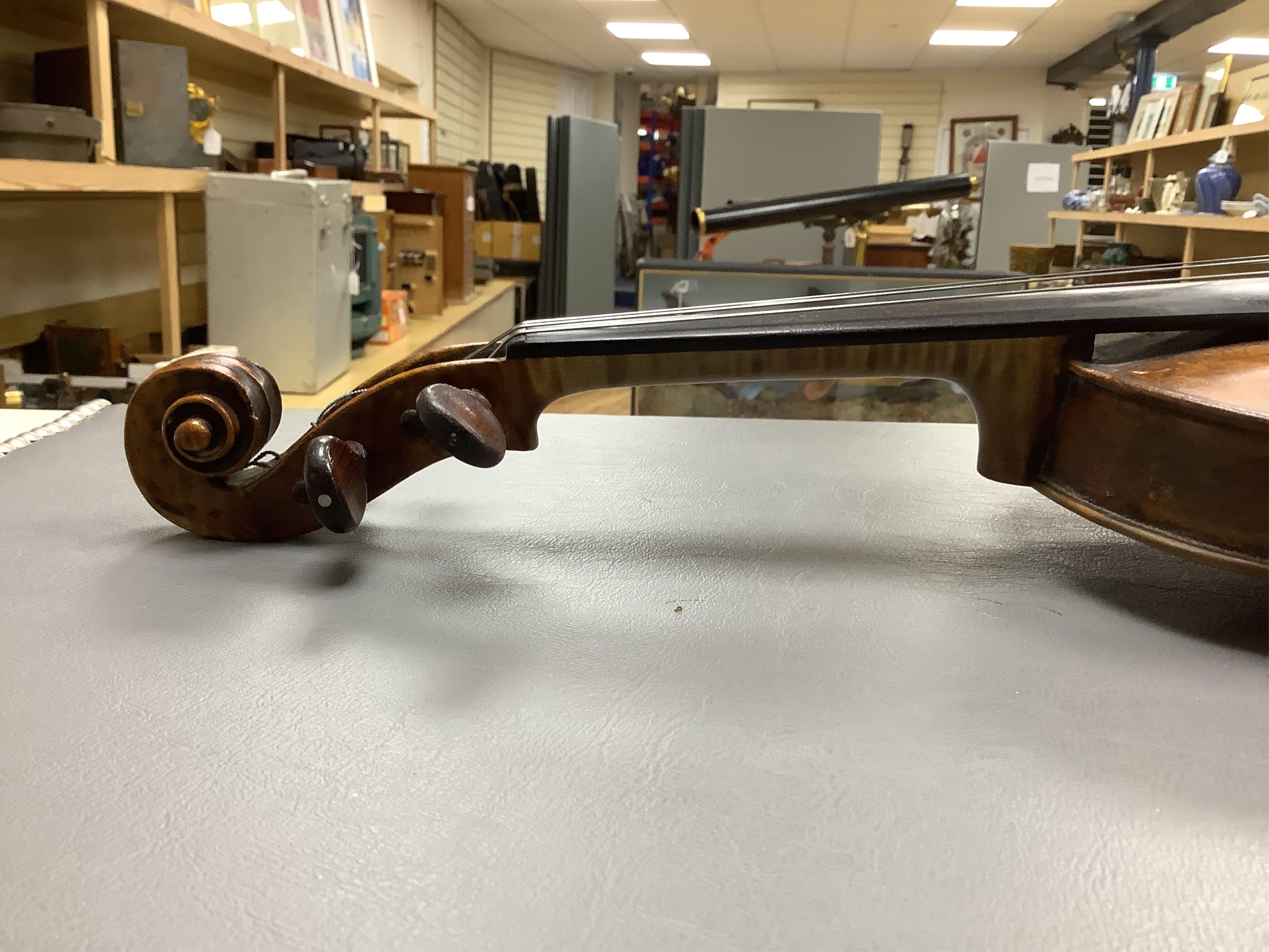 An interesting late 18th century violin, with one piece bird’s eye maple back, unsigned, with two silver fully mounted octagonal bows, one stamped Voight CITES Submission reference, 3XFNUBT7 and Submission reference, RHL